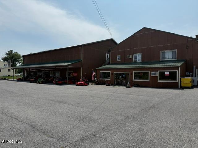 Commercial bldg. Centrally located in Blair County close to I99. Showroom and garage space and parts counter for sales. Property has large parking lot and plenty of room for expansion in the rear. Call for more details.