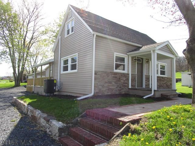 If you're looking for a nice home this is it!!  This cape cod has been remodeled from top to bottom.  Open concept on main level, kitchen w/ hickory cabinets & stainless appliances, light & airy LR, DR with sliding patio door to the covered side porch, 1/2 bath, laundry room and first level master suite.  Master bedroom has a vaulted ceiling, door to the deck for that morning coffee, walk-in closet and master bath.  Second level offers two bedrooms and a full bathroom.  New roof, siding, windows, soffit/fascia, gutters, insulation, drywall, electric & wiring, kitchen, baths, paint, floor coverings and plumbing.  Recessed lighting throughout, covered porches, deck and new two-car garage.  Large double-lot.  Convenient location and just a short walk to the downtown area.