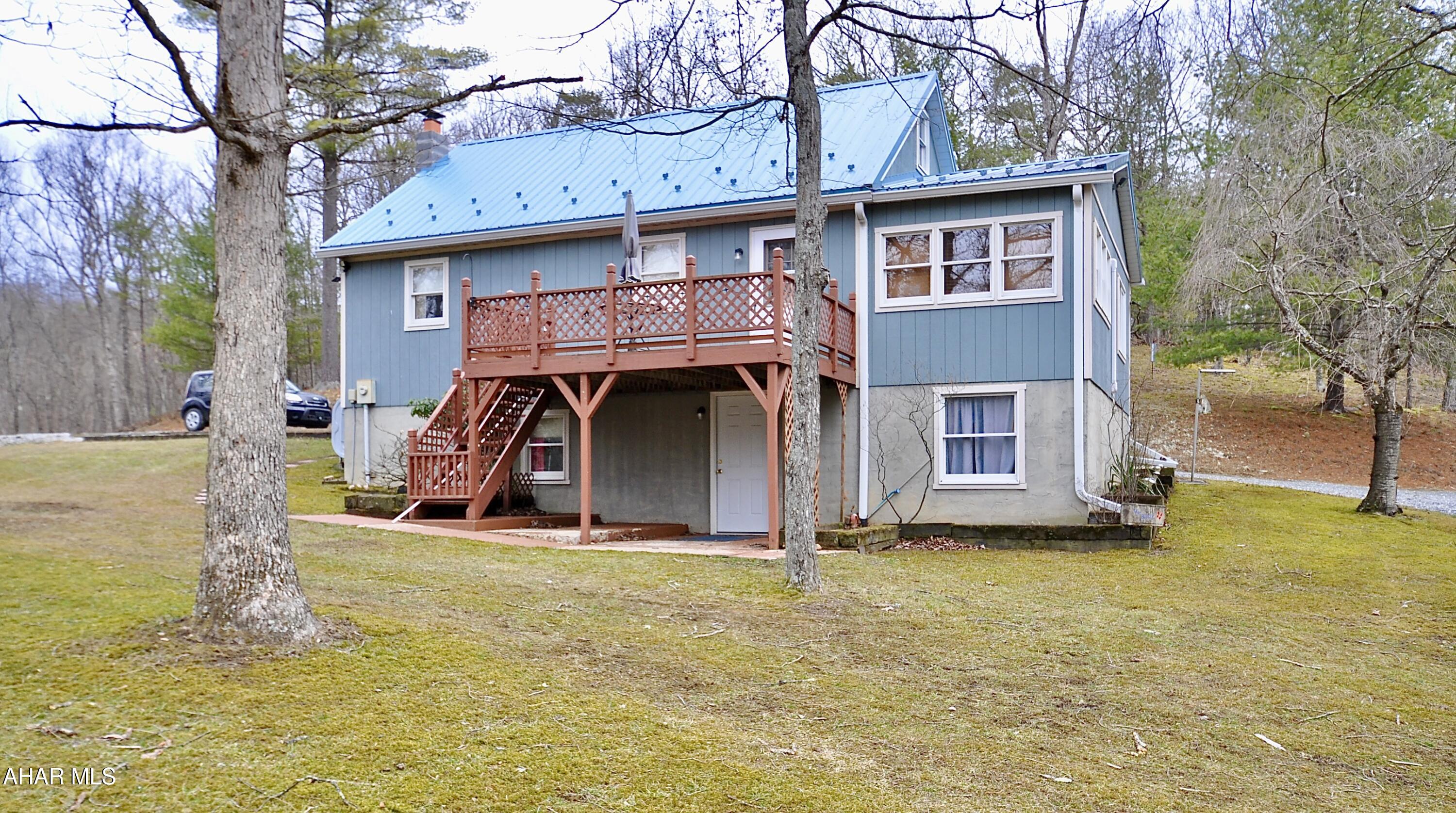Wonderful hilltop cape style home on 5 acres! Lots of privacy, just minutes from Shy Beaver Boat Launch and beautiful Lake Raystown. This year round home has new metal roof, as well as 3 mini splits providing heating and cooling. There is also an oil fired hot air furnace. The full unfinished basement, dry as a bone, walks out to grade. Neat as a pin and ready to move in. Priced to sell do not wait!