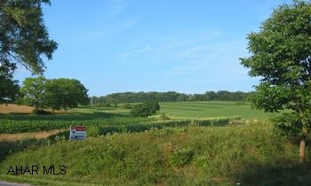 Wonderful site for development.  Public sewer stops at bridge (before property - after golf course).  Survey on file.