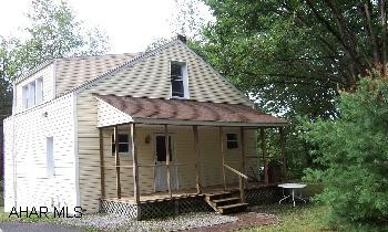 Updated 1.5 story home  in a great rural setting.  From Tyrone, Rt 453 (Janesville Pike) through Janesville, make 1st right after Janesville, house is on the left. School district is Mo Valley. Updated 1.5 story home in a great rural setting. From Tyrone, Rt 453 (Janesville Pike) through Janesville, Make 1st right after Janesville, house is on the left. School district is Mo Valley. Public sewer is in the process of coming through, tap in fee is $1000. Seller may consider owner financing.