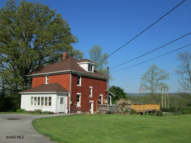 Hollidaysburg Schools!  Check out the all brick, 4 bedroom with 2 baths.  If you want quiet, private, and room to roam, this is it!  This classic brick features new windows, new roof, updated eat-in kitchen and large room sizes!  The great views from the deck are free!