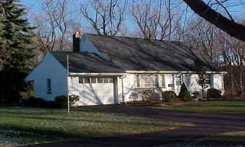 Large Master BR first floor with 2 huge closets. Two nice sized BRs on second floor with full bath. Very nice home.  Quality built cape near Mansion Park. Hardwood floors throughout. Brand new furnace, new roof, and electric system.   Lot to right included in sale. (1.6-22-5) Flood insurance is required.