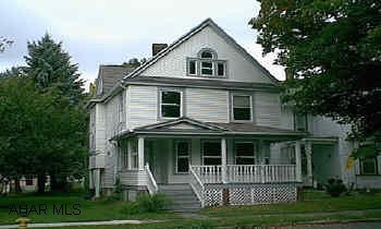 Large home with 3 bedrooms, sewing room, living room, formal dining room with fireplace, built-in cupboards and pocket doors, eat-in kitchen, 1st floor laundry, closed-in back porch, 2nd floor rear porch, attic has 2 rooms.  All new wiring 100 amp with 22 Large home with 3 bedrooms, sewing room, living room, formal dining room with fireplace, built-in cupboards and pocket doors, eat-in kitchen, 1st floor laundry, closed-in back porch, 2nd floor rear porch, attic has 2 rooms.  All new wiring 100 amp with 220v. New vinyl siding/insulated, new roof, copper water lines, new water line to street. All exterior work finished. Cosmetic work needed inside. LOT: 32x180