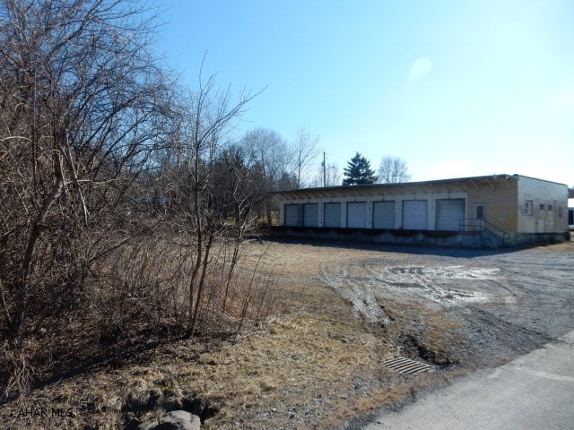 Prime commercial location in Duncansville, with NO zoning and survey on file.  Approval needed from Blair Township for building permit.  40 foot unopened R.O.W. for utility easements.  Phase one environmental assessment was completed in 2008.  BSL = 35' front, 15' side and 25' to the rear. No current utilities are active.  Property will be subdivided from parcel #22 which is also owned and is not for sale.  Building has a total of 14 dock doors.
