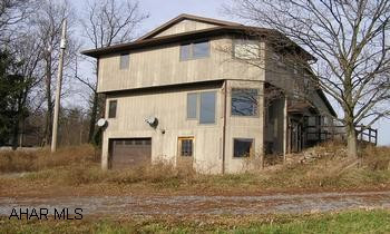 Custom 2-Story 3BR/2BA contemporary on 2 acre hilltop with panoramic view. Forbes Road School District. Custom 2-Story 3BR/2BA contemporary on 2 acre hilltop with panoramic view. Airy interior, large living room, big master bedroom. Decorative wood accents, main level laundry w/cabinets, slate flooring, zoned oil HW heat. Handsome den on ground floor.
