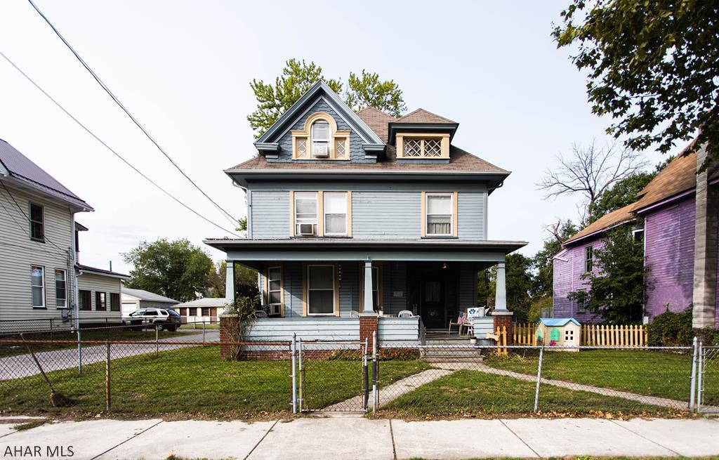 Large 5 bedroom, 2.5 bath house with a fenced in yard, detached 3 car garage, and big welcoming front porch. Pantry. Stained glass windows. French doors. 2 stairways. Beautiful woodwork throughout the house. Spacious bedrooms. Laundry room. Priced to sell. Don't miss this large Victorian house filled with character and charm!