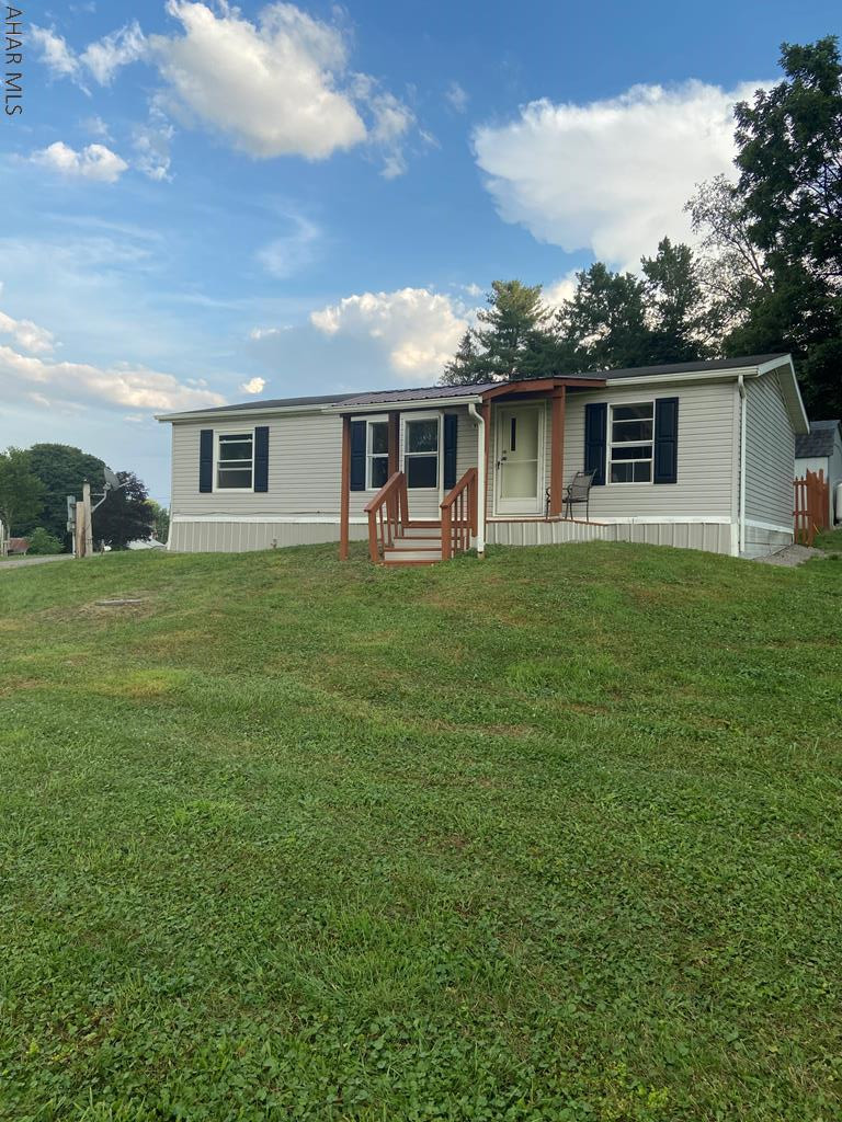 3 bedroom, 2 full bath on a beautiful private 1.28 acre property. Enjoy the front covered porch while watching wildlife. Detached garage. New flooring. Fresh paint.