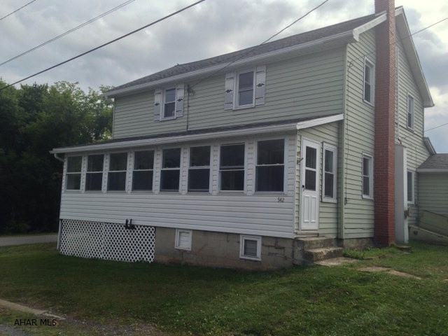 This is a home with a lot of space, on a corner lot, and just over 15 minutes to Raystown. There is a large bonus room downstairs that could be used as a fourth bedroom or as an office. The living room is wired for surround sound, and connects to a recently updated sunroom. Additionally, the furnace is set up for wood, coal, or oil, and the home is only a short distance away from the elementary school.