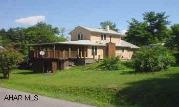 Security system installed but not functional. Nice 1 1/2 story home on a double lot in Lakemont. Home features central air and fireplace, large bedroom on 2nd floor, skylights, floor to ceiling windows, and many more amenities!