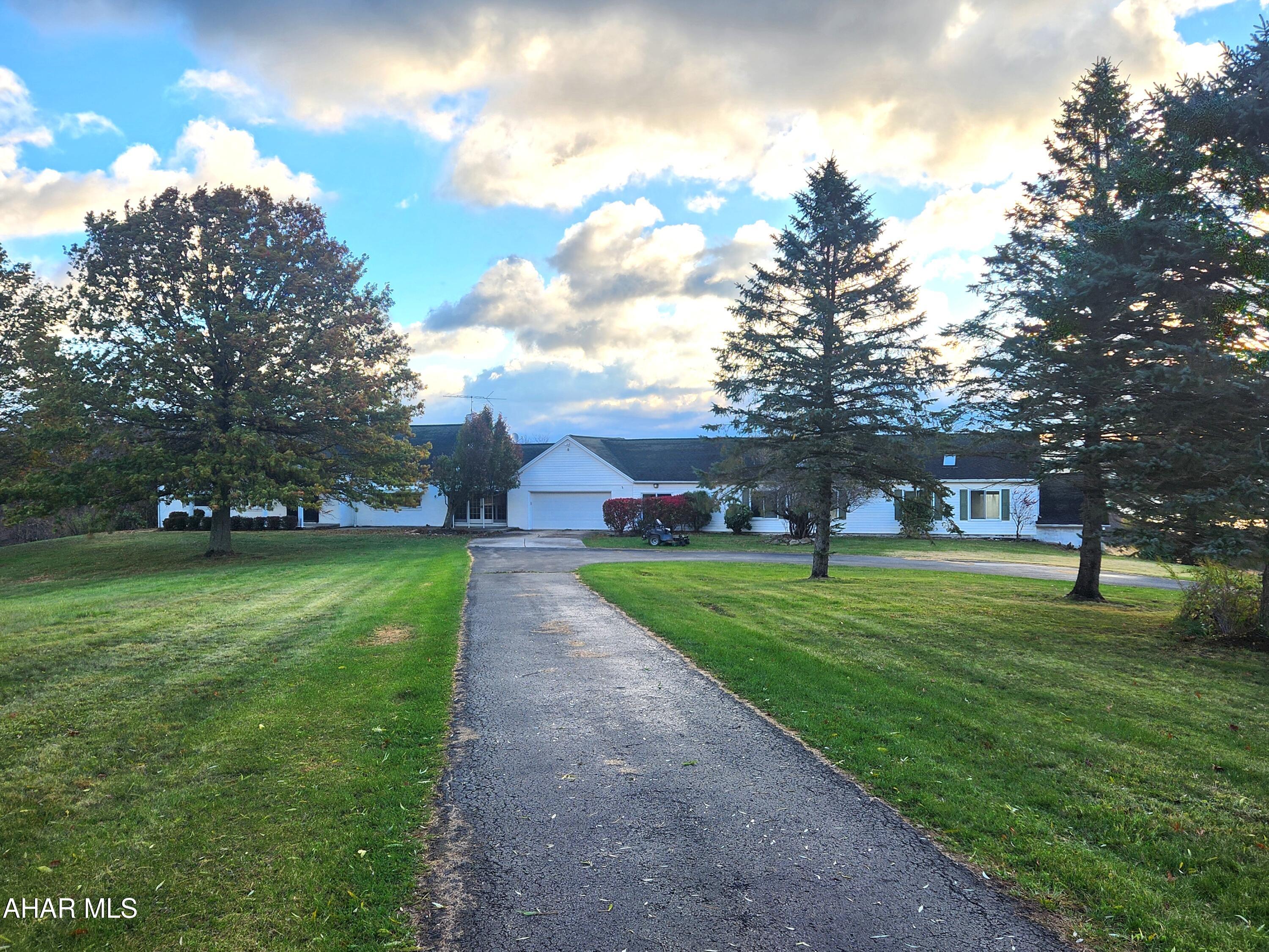 For comparable sale purposes only.  Brick home with 2,586sf, partially finished basement, indoor in ground pool, 72.425 acres, attached two-car garage, detached one-car garage and two barns.