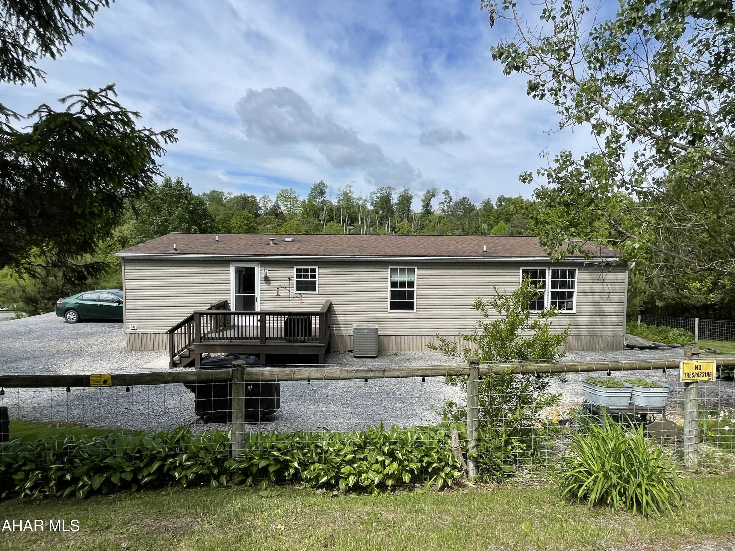 If you enjoy entertaining, camping, a natural water feature with the stream bordering your property, a large garage for hobbies and living in the country then look no further than this one of a kind beautiful peaceful place all sitting on 3 acres!  The duck, chickens and coop will be included along with a regular visit from the neighbors peacock! This beautifully maintained home features 3 bedrooms 2 full baths a large eat in kitchen with hickory cabinets, a living room and a bonus family room.  The outside space is spectacular... a massive garage for your tractor, side by side, boat, camper, collectible car or whatever your heart desires.  The pavilion is incredible for entertaining!  There is plenty of space for your family to spread out and enjoy this incredible country setting.