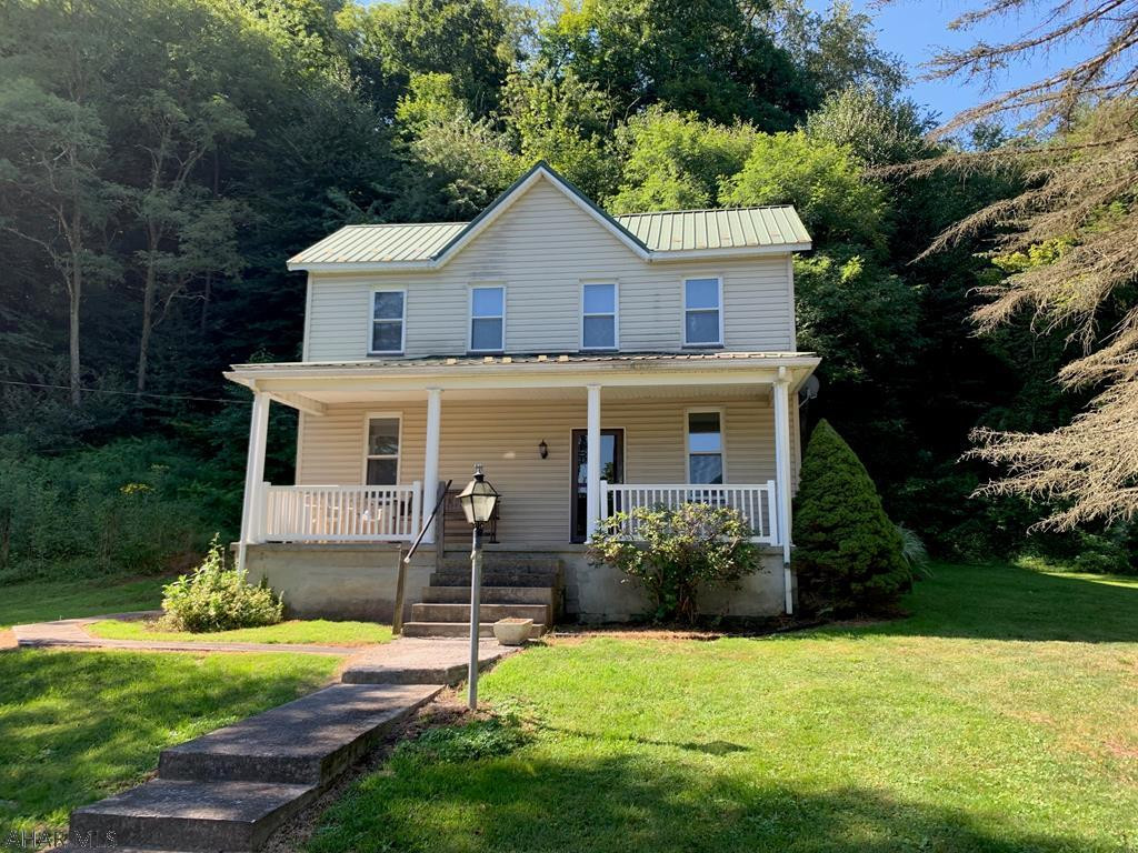 Rare find, two-story home located in the Hyndman Borough with 53.404 ACRES adjoining State Game Lands!  Very convenient location and mostly wooded land.  Home offers a living room, dining room, kitchen, 1/2 bath & laundry room combo and mud room on the main level.  Second level has four bedrooms and a full bathroom.  Covered front and side porch, oil forced air heat and wood stove, metal roof and vinyl siding.  Detached pole building used for a garage.  New survey completed on the property.