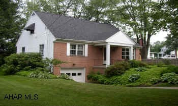 CHARMING CAPE COD ON WELL LANDSCAPED LOT.  SUNROOM 12X15 WITH VAULTED CEILING AND TILE FLOOR.  METICULOUS!  HARDWOOD FLOORS, PLASTER WALLS, NEWER KITCHEN, CHARMING SUNROOM (ADDED).