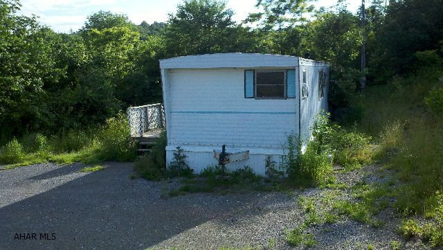 Beautiful 8.39 acre parcel with well & septic - beautiful views.  There's a 12x60 mobile home, but no value is given to the mobile home - flooring pulled out, (carpet, etc.).  Great spot for a new home.