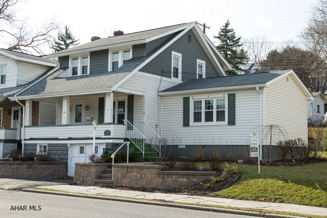 A professionally landscaped yard welcomes you to this fantastic home, close to the Penn State Altoona campus.  Maintenance free insulated siding and windows help keep utilities low and comfort high.  An over sized main floor master suite, with full bath, is fantastic for those who want single floor comfort, or it could be used as a large family room or game room as well.  Downstairs you also have a dining room just off of the kitchen and living room, that has fantastic views of the professionally landscaped back yard. Upstairs, three bedrooms and a full bath offer plenty of options.  The back yard, with a paver patio, and a wonderful decorative block retaining wall, offers a perfect spot for entertaining, or private enjoyment.  You definitely don't want to miss this home!