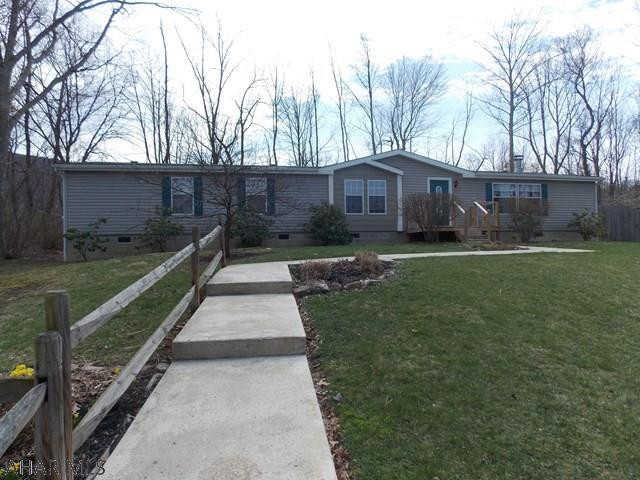 WOW! This home is huge with wide open space for entertaining. Lovely stone fireplace and surround sound to relax and watch movies or sports with the family. There is also an additional living room when entertaining large groups. Unbelievable master suite is sure to please with sitting area to read  or watch TV and double doors leading to the luxurious bath. The other 2 bedrooms share another large bath with double sinks. Great outdoor space and privacy on the large lot with 2 decks one is 16x16 the other is 12x12.  Many of the trees and shrubs will be flowering soon and show lots of beautiful color.  Home also has 2 sheds for storage. 2017 taxes are estimated.