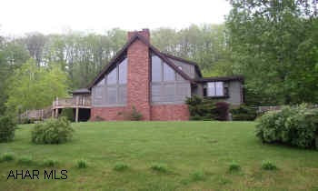 LANDSCAPE BLOCKS ALONG DRIVEWAY TO BE INSTALLED PRIOR TO SETTLEMENT.  THE VIEW IS FREE! IMMACULATE "A" FRAME FEATURING 1ST FLOOR MBR SUITE, CERAMIC & HARDWOOD FLOORING, BEAUTIFUL OAK EAT-IN KITCHEN, LR W/FIREPLACE AND FINISHED LOWER LEVEL WITH FIREPLACE AND WET BAR. MULTIPLE HEATING FOR BASEBOARD HOT WATER. KITCHEN APPLIANCES INCLUDED.