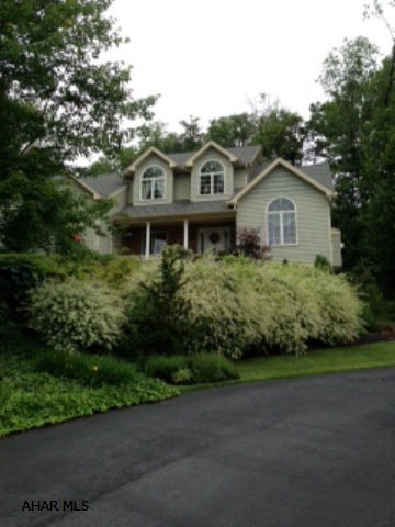 Enjoy the spectacular view from this tastefully decorated two story. Snuggled into the hilside, private and peaceful. 10ft ceilings and crown mold in master suite, (master on first floor) master bath. Whirlpool tub, pretty tile surround, cherry cabinets, granite top and sep. shower. Kitchen w/eating area and door to deck, open concept, dining area flows to kitchen and door to enclosed screened porch w/ceiling fan. Laundry first floor - 2 car garage, full basement, unfinished with rough in for bath. Only 5 years new. ** Seller must find suitable housing.