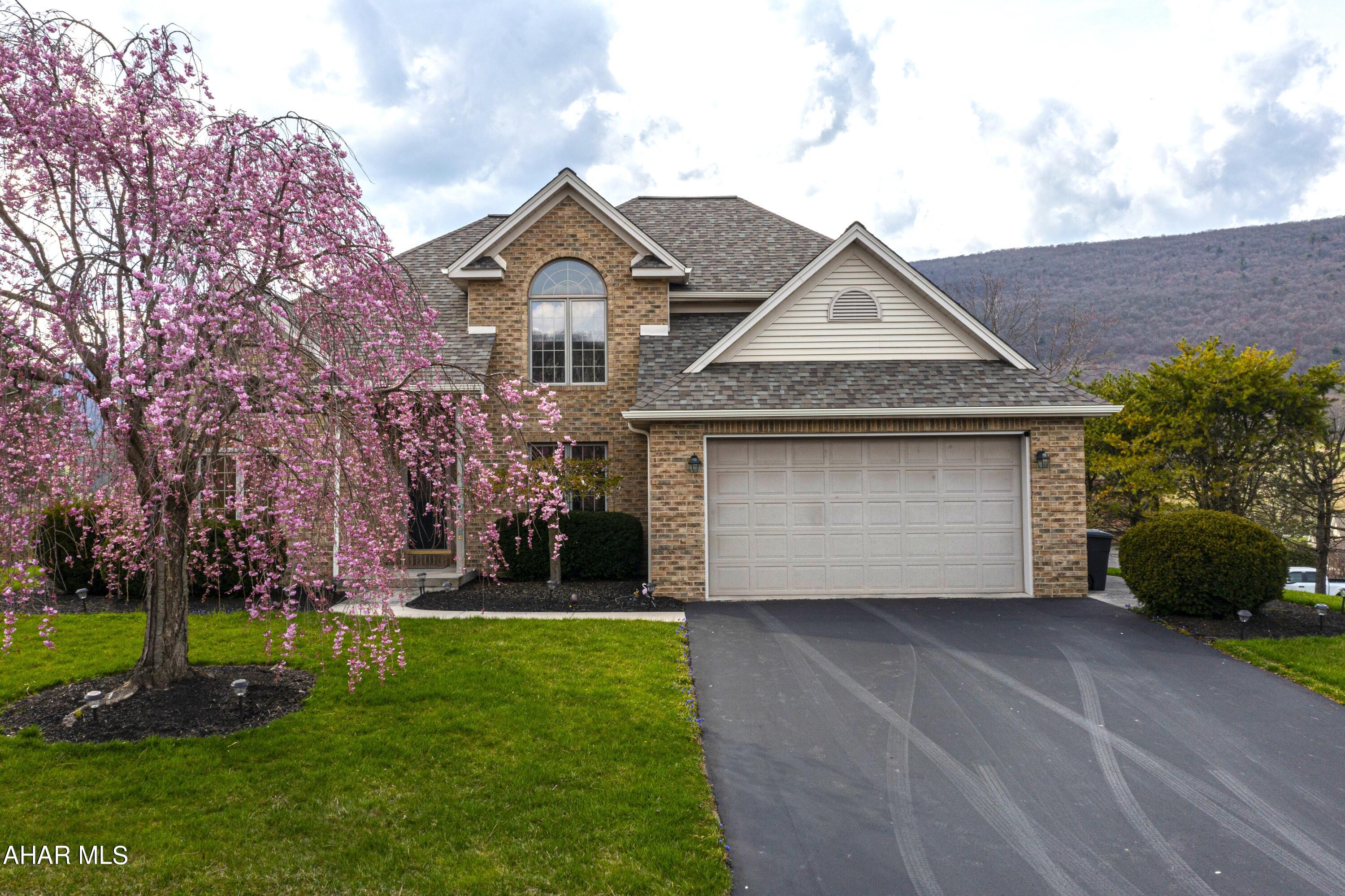 Stunning, brick faced, 2 story, 4 bedrooms, 2.5 bath home situated on approximately 0.69 acres in the desirable Scotch Valley subdivision! Tall ceilings, abundant natural light, and hardwood floors welcome you as you step inside the front door. Featuring a formal dinning room, formal sitting room, first floor master bedroom with master bath and walk in closet this beauty will be sure to make you say WOW!  Picturesque views can be captured all year round by the oversized windows throughout the first floor. As you make your way to the kitchen you will not be disappointed as there is  ample counter space, cabinets, an island, pantry, and breakfast nook. The second floor boasts 3 large bedrooms, and a full bathroom. Sliding glass doors lead you to the freshly painted, spacious  back deck and yard where you can entertain guests, relax, or soak in the gorgeous mountainside views. A NEW roof was put on in July 2023, as well as a new water softener and water purifier done in 2022!  Located just minutes from Canoe Creek State Park, this home offers the perfect blend of serenity and outdoor adventure!