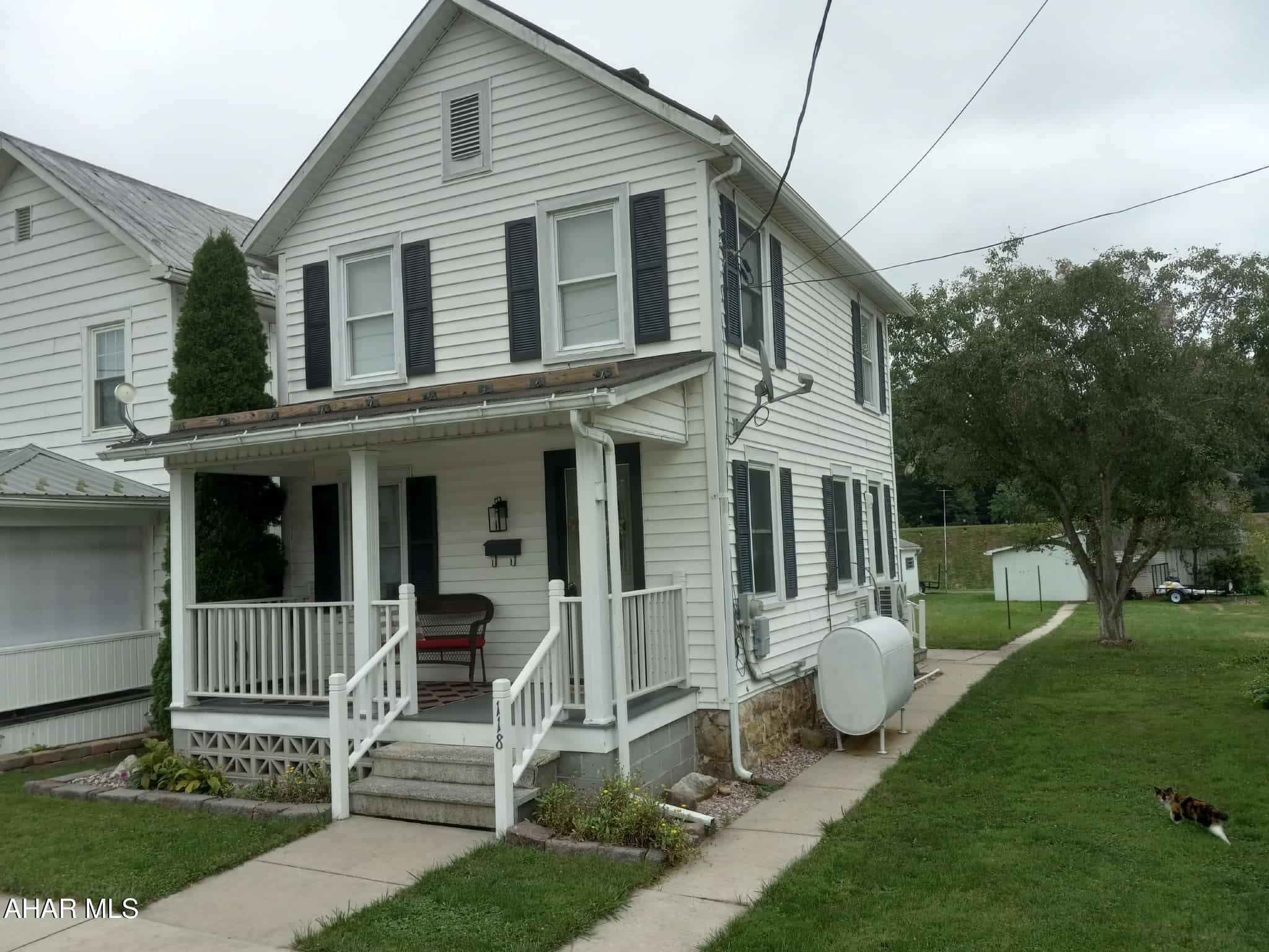 This 2-story home is just the place for starting out or starting over.  
Close to downtown and all conveniences, but on a quiet street.  Relax on the lovely, covered, front porch.   The back of the house has a screened-in porch and short-walled patio - ready for grilling and picnics.  Nice, level back yard - great for kids or pets. Enough room for a garden.  Lot is street-to-alley for easy access to a 1car garage.
Inside, enter the inviting living room.  The kitchen is small, but you can make it your own AND there is a separate dining room.  Newer, Thermopane windows, vinyl siding - well insulated - easy to heat.  Mini-split heat pump contributes both heat and cooling.  The new furnace produces  efficient heat for those cold winter days - help[ng to keep heating costs low.  
Start Here!  Monthly house payments are less than rent.  If you can afford to rent - you can afford to own.  Instead of renting, begin building equity.












  If you can afford to rent - you can afford to own.