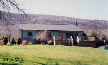 Ranch home with vaulted ceiling, 2BR, 2BA on 3/4 ac, newer wraparound deck, roof, heat and cemtral air. Good view.