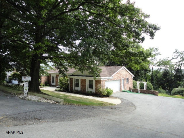 Hardwood floors, large driveway, mature landscaping, move right in.