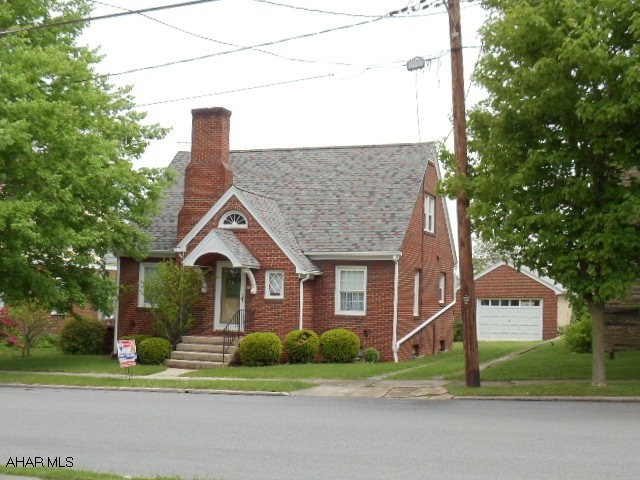 Beautiful Brick home with first floor bedroom, fireplace, hardwood floors, 1.5 baths & formal dining room.  Nice flat back yard.  1-car garage, newer vinyl windows.  Roaring Spring to Martinsburg, right at light, 1 block left on Penn Street home on left.  #J-986