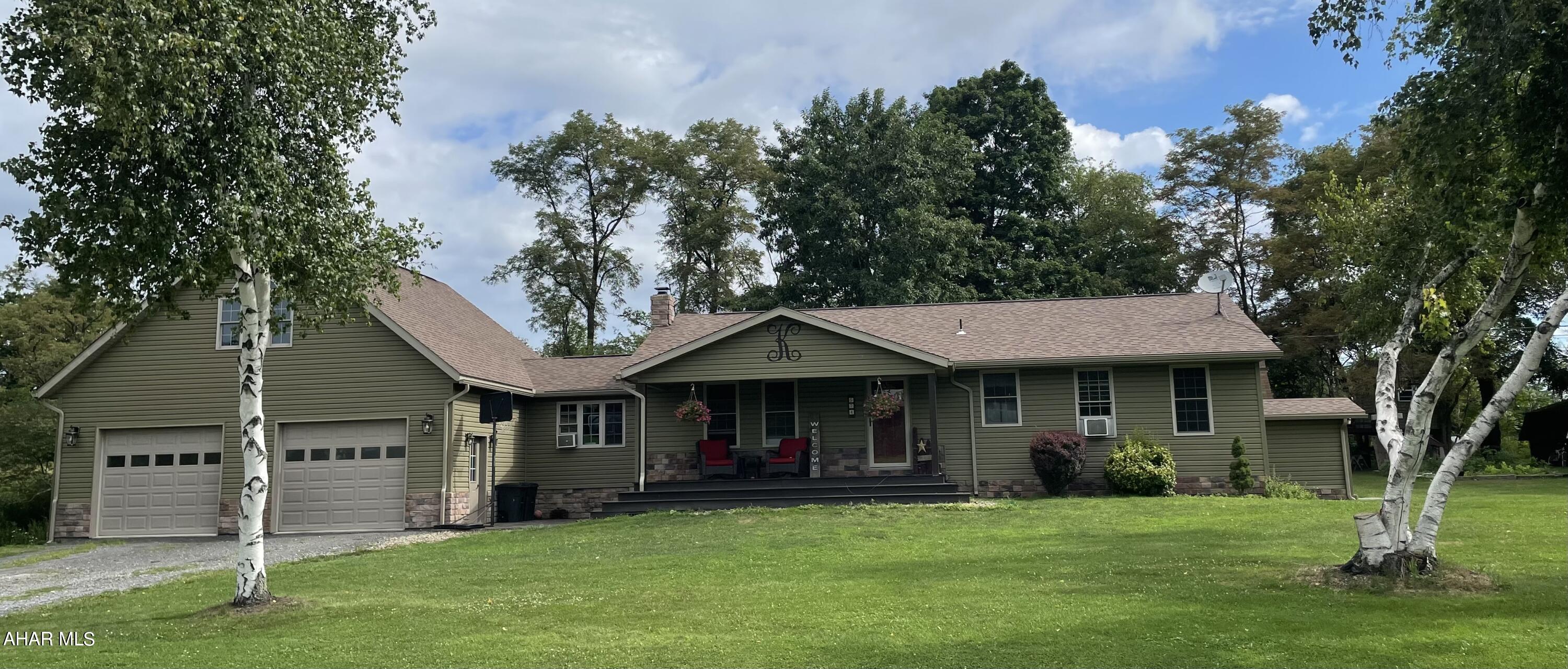 Enjoy country living in this updated 3-bedroom, 2 bath ranch house! The spacious kitchen and dining area features an Elmira Stove Works range with a propane cook top and electric oven. Pick a porch on which to relax and enjoy the quiet view of fields and trees. The 32x32 garage offers plenty of space for vehicles and includes a bonus storage space. The basement is partially finished and ready for the next owner to make the space their own. Call today for your tour!