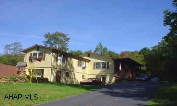 Large ranch with attached apartment. Great condition, all appliances, quiet setting and more. The attached apartment includes 1 BR, LR, Kitchen, and bath.