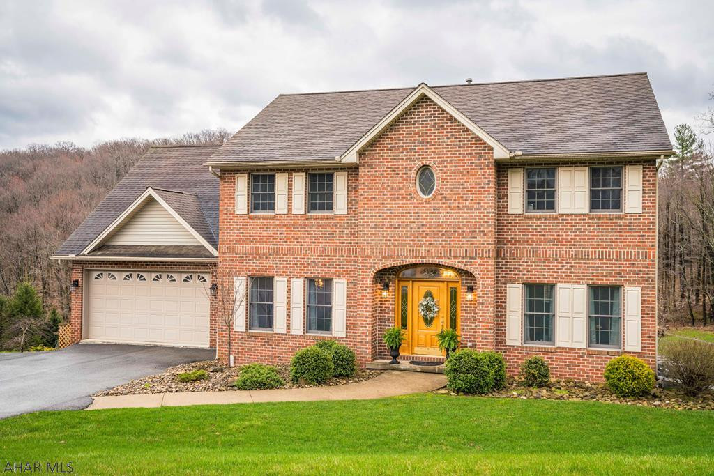 This home is an HGTV dream.....nothing to do but move right in!  New flooring, freshly painted, new light fixtures are a few of the pluses. The kitchen boasts gorgeous, rich Granite counter tops, SS appliances, breakfast bar and storage. Chilly nights are no problem...just cuddle up close to the fireplace.  The owner's suite has a walk-in closet and a fabulous bathroom...jetted tub is perfect for relaxing!  The kids can have their own space in the finished, walkout lower level. Laundry options on both the 1st and 2nd floors.   Enjoy evenings on the covered deck, patio or 3 season room while the kids run and play in the big yard. Central vac and radon systems are in place. Close to UPMC, Altoona Campus and Juniata Gap School. Homes like this don't come on the market often...a rare find!