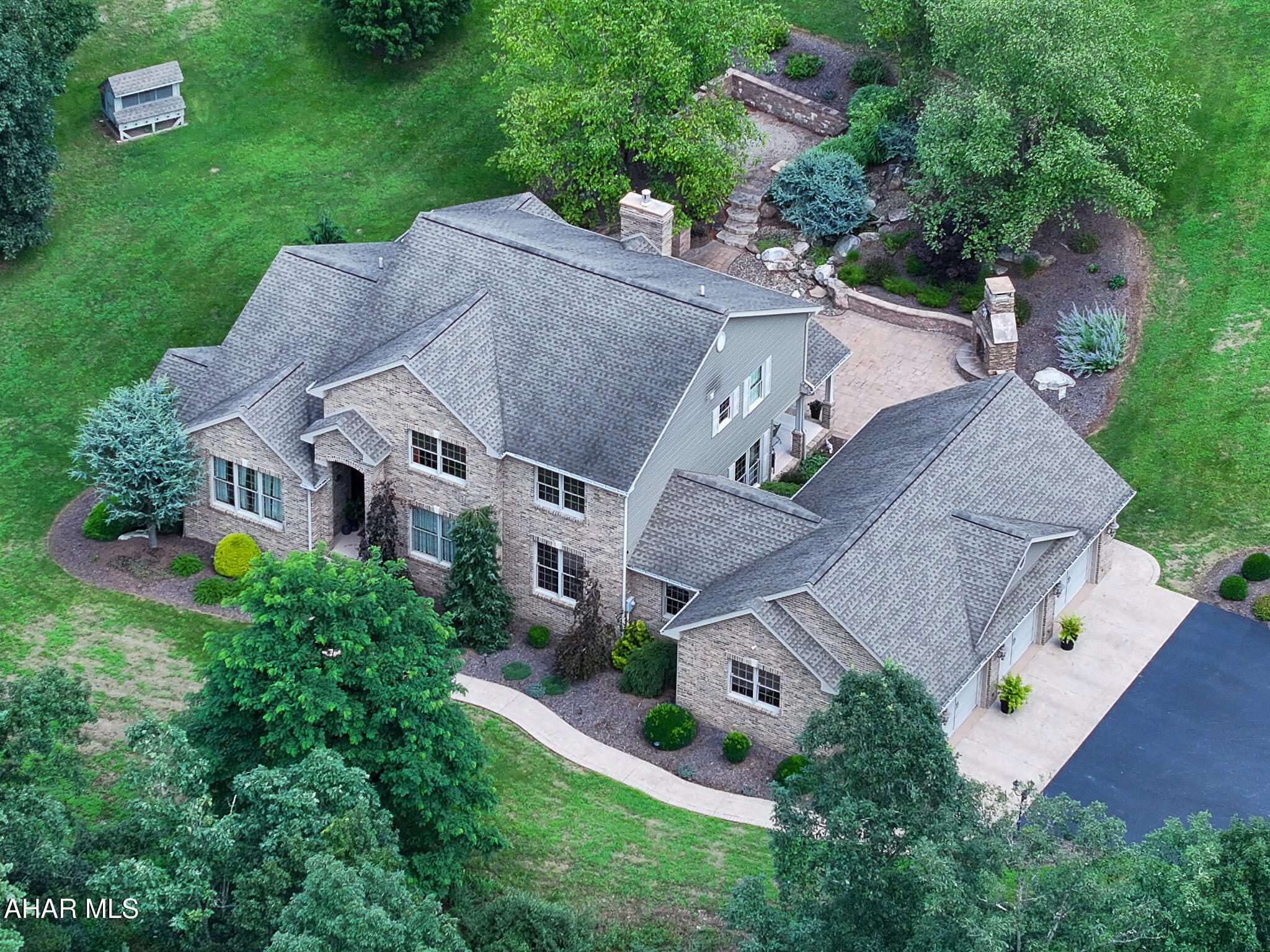Stunning Custom Built Brick Estate on 23.83 acres. Drive up to the gate that opens to your own private paradise. 6 bedrooms , primary bedroom is on main level with 2 walk-in closests and amazing bathroom. 4 bedrooms upstairs with full bath, bedroom 6 is in the finished  basement.   Gourmet kitchen with granite countertops, custom made granite sink. wraparound counter, kitchen is full of unique features and lots of great lighting.  Has a cozy breakfast nook. Main level laundry room. Cozy family room with gas fireplace, formal dining room , formal living room off the spacious front foyer.  Finished walk-out basement has kitchenette , large family room with another gas fireplace perfect for friends and family gatherings. Hidden gem is a  secure safe room, lots of storage and utility room. Beautiful flooring thru-out the entire home, tray ceilings , crown moldings . You must see all the beautiful extras to appreciate. 
Outside living shines with a covered patio,  landscaped gardens, outside stone fireplace and soothing water features.
Additional Highlights include:
Heated 3 car attached garage with epoxy flooring.
Separate detached garage for your outside toys/camper/tractors etc.
Fenced in farmers area with outbuilding.
Chicken coop and custom playhouse.
Home is a private oasis , peaceful and move-in ready , luxury country living just minutes from town!