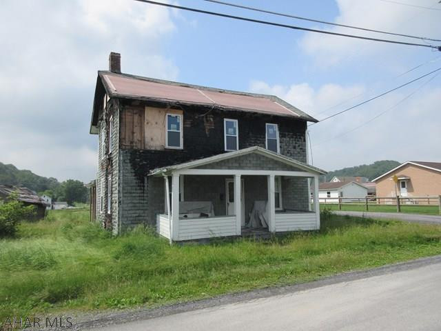 AS-IS sale. Structures on property should be razed and have fire damage and structural issues. DO NOT ENTER STRUCTURES ON PROPERTY.
