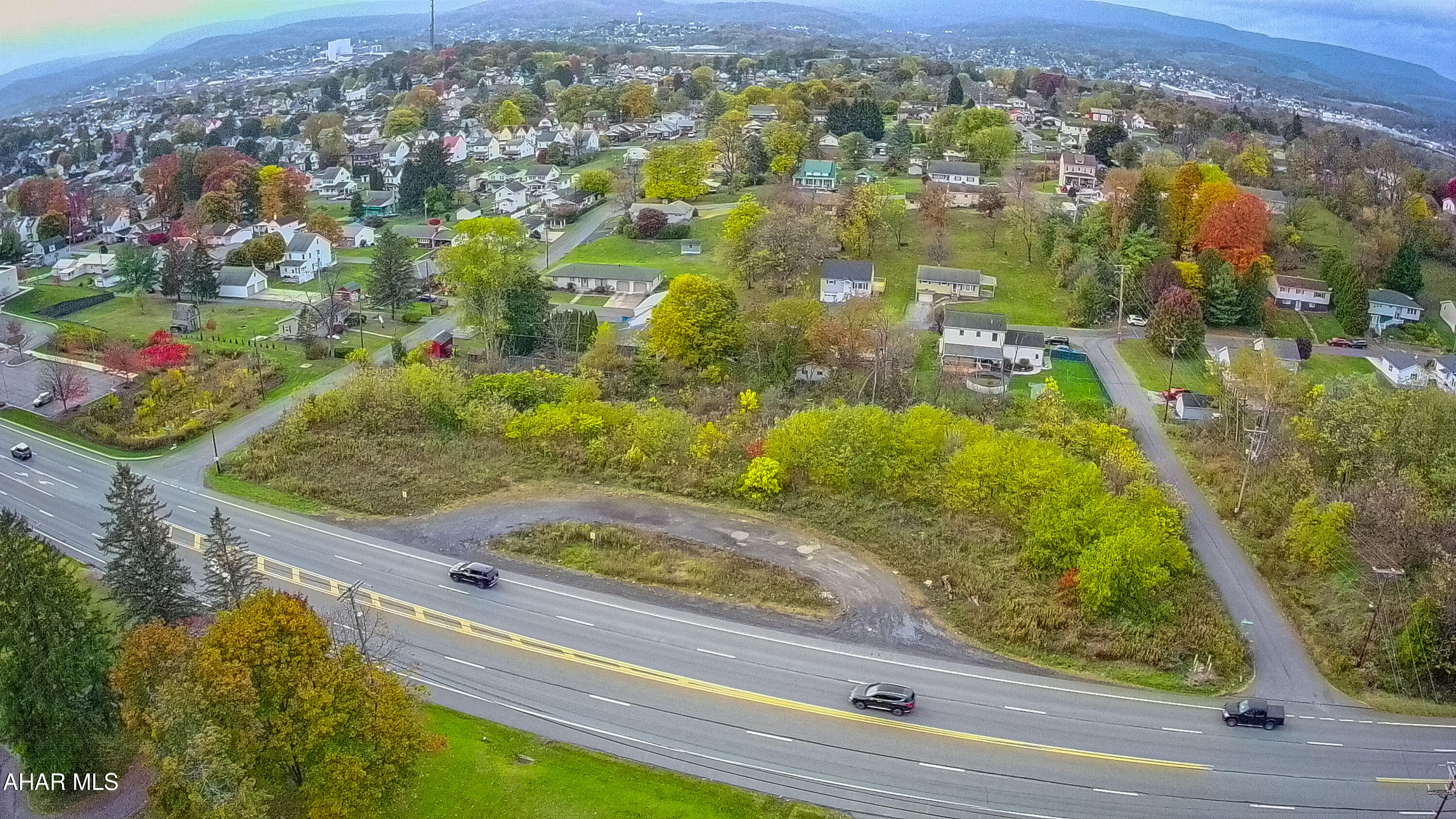 This prime 1.3-acre commercially zoned lot presents an outstanding development opportunity, boasting excellent visibility and high traffic count on a main artery, making it an ideal location for a wide array of high-demand businesses.  Its flexible zoning allows for many lucrative possibilities ...