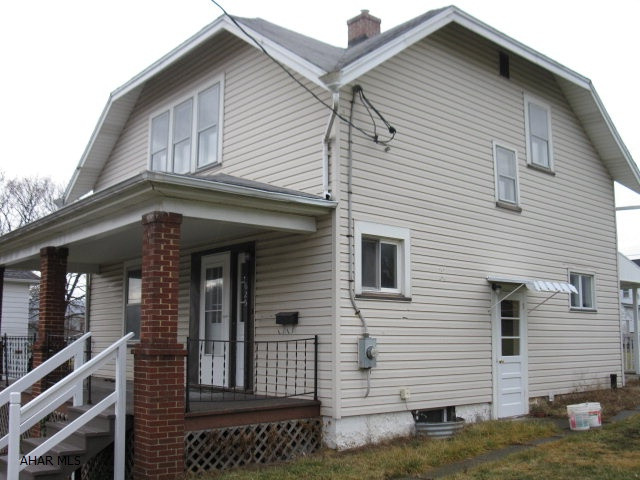 LIKE BRAND NEW! Total interior remodel.  New kitchen with dishwasher and microwave/range hood combo, new bath, drywall, flooring, doors and fixtures.  Newer furnace and thermo windows with central air unit to be installed prior to closing weather permitting. Large level yard with alley access and off street parking, two sheds and front porch with a great view.  Walk to YMCA, parks and playgrounds.  Great opportunity to own a like new home for under $100,000!