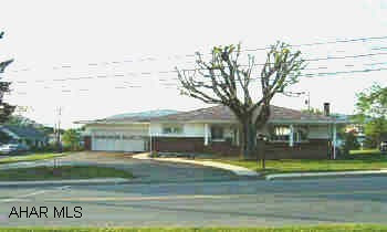 Well maintained Ranch Home. Zoned commercial.  3rd Bedroom with Bath in basement.  Laundry chute to basement. "Cave" for year- round food storage in basement. 10' x 12'  Storage Shed. Brick/Vinyl Ranch on large corner lot with 3rd Bedroom/Full bath in basement.   Well maintained. Central Air.  2 Car Att Garage. Hardwood Floors.  Zoned commercial.