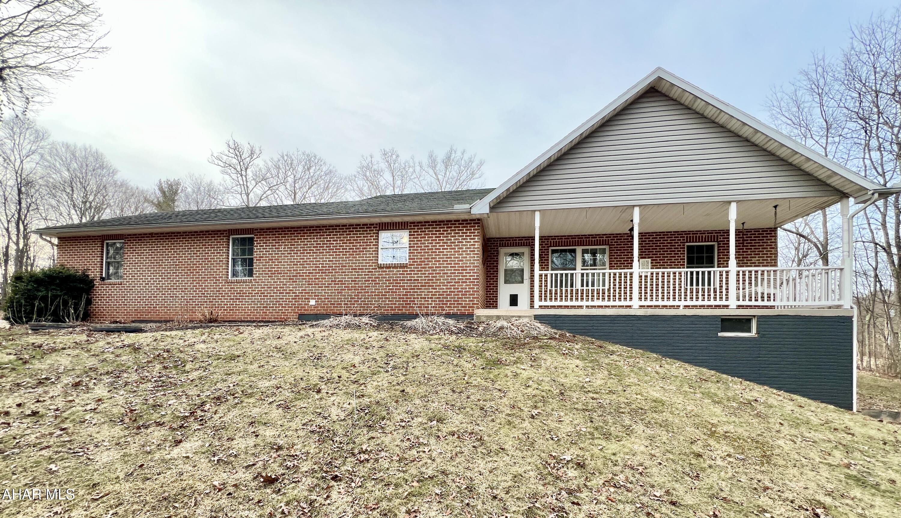 Looking for a private getaway or a forever home surrounded by nature? Then take a look at this well-maintained 3-bedroom, 2-bath home nestled in the woods resting on 2.6+/- acres. This home offers an open concept with a living room, dining room, eat-in kitchen, 3 bedrooms, 2 baths, and a mud-room with laundry. Additionally, the home has an attached two-car garage and walk-out basement. Outside you will find a covered front porch, large deck, and an oversized run-in shed. The setting of this property provides an excellent place to get away from the hustle and bustle of life and enjoy the outdoors, being conveniently located minutes away from Buchanan State Forest and offers easy access to I-70, I-68, and the PA Turnpike.