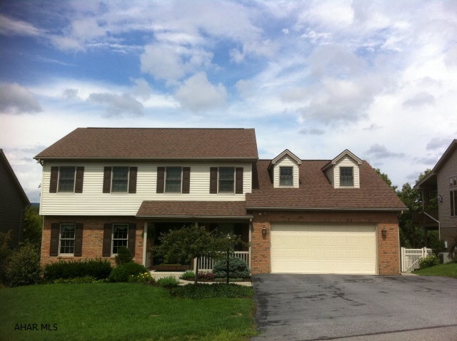 Great Family Home. Kitchen is eat-in with large island open to family room with vaulted ceiling, skylights and gas fireplace. There are built-ins beside the fireplace. Laundry Room is on 1st floor and has a laundry tub. The master bedroom has a large.   bonus room which can be an office/exercise room The master bath has been redone with new cabinets, tile floor and had a Jacuzzi tub with separate shower. The basement is walk out and finished with 1/2 bath and gas fireplace. There is also a storage room and a Utilitie room. The outside has been professionally landscaped. The deck is covered. The lower level is a patio of Pavers...Don't miss this warm immaculate home....convenient to schools and all shopping.