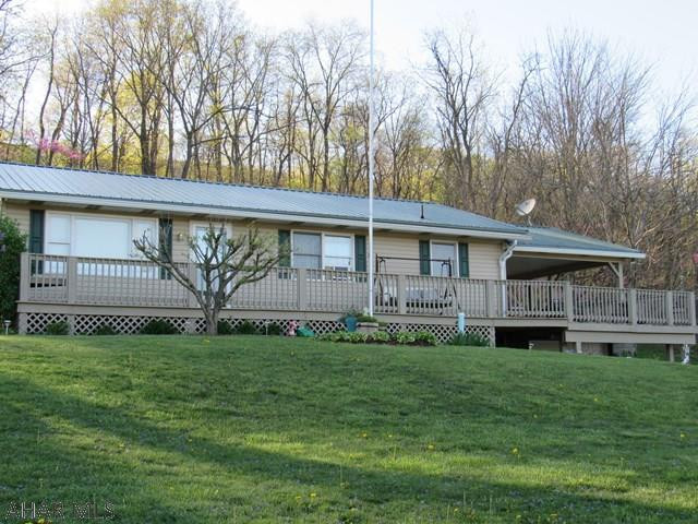 If you are searching for a full time residence or a weekend getaway you will feel at home in this 4BR,2BA Ranch on .69 of an acre. Newer siding,Newer metal roof,gutters,shutters,Newer furnace,Newer garage door,Newer hardwood floors in kitchen & dining room, & New 1st Flr  shower.This home is close to several boat launches in James Creek.Entertaining is easy on the lg front deck & larger covered deck (handicap accessible) overlooking the nice landscaping with its ornamental trees & lots of flowers.Inside you will find an open floor plan from KIT to DR to LR.The 3 BRs upstairs,newer bath has double bowl sink,large linen closet. In addition to a nice family rm in the basement with its Fisher wood burner there's a 2nd Kit,BR,   BA,lots of storage&laundry/mud room. This is PRICED TO Sell!