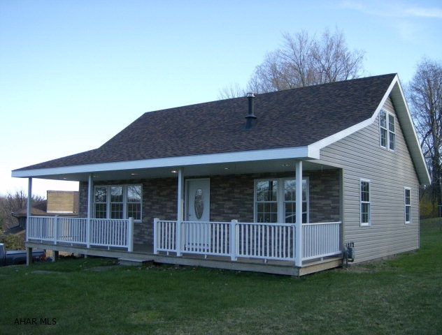 Ebensburg -Quality construction throughout! Remodeled 4 BR, 2 bath home on a large corner lot in Crestwood Estates. Eat-in kitchen with stainless steel appliances & new Oak cabinets! Oak laminate floors. Granite counter tops in baths. Finished family room in basement. New natural gas furnace with 3 zone hot water heat. Large covered front porch. Move-in condition!