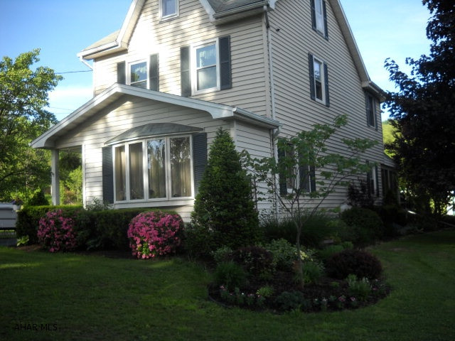 Enjoy this beautiful home on a 1.4 acre lot in Logan Twp. Nicely decorated and updated with featues including vinyl siding, finished sun porch, rear deck/patio, koi pond w/waterfall, professional landscaping. Low taxes.