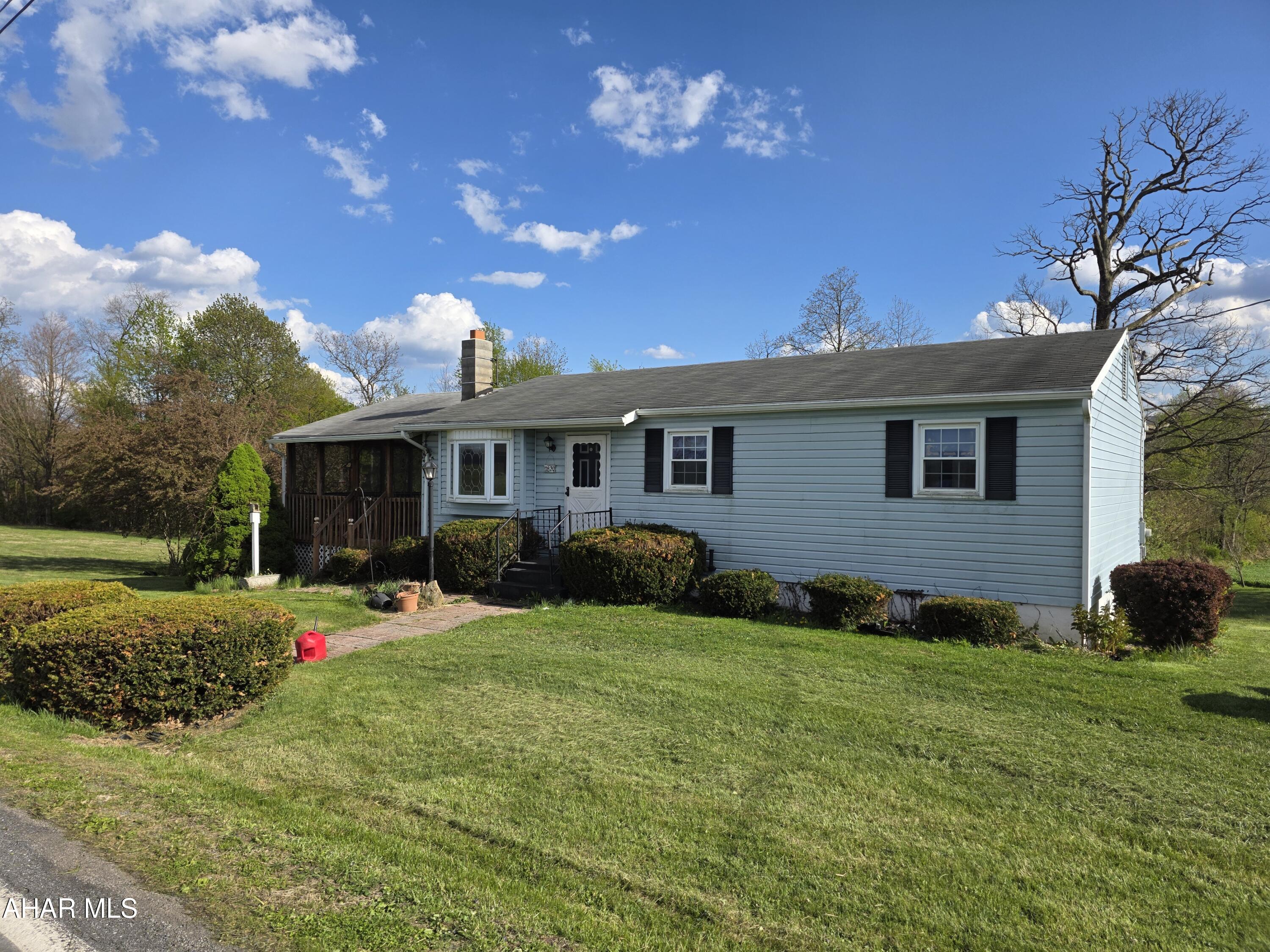 3 bedroom rancher with 1 car garage on 1.13 acres in Sinking Valley. Modern kitchen and bathroom. Large covered deck. Lots of potential.