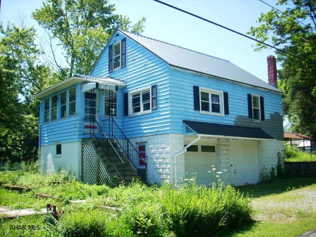 Newly subdivided raised ranch home on spacious 150x75 lot.  New metal roof, picnic area with fireplace and pavilion.  Kitchen and bath need remodeled/updated.  Great opportunity for the handy buyer!!  Beautiful retaining wall.  House needs painted.
