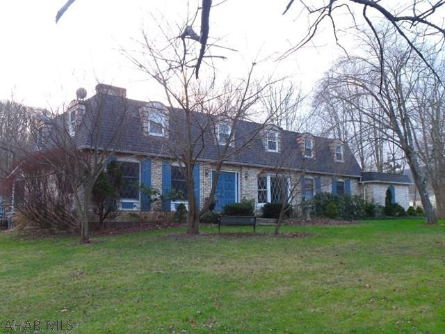 Logan Township. Well built 4 bedroom home on 2+ acres. If you desire a private location then this one owner home is for you. Newer roof, newer furnace and some new windows. All room sizes on first floor are large and feature new flooring. The island kitchen leads out to a 3 season room with all new windows and doors. There is a large unfinished room above the two car garage. Items included with the sale are: refrig., elec. range oven, micro, DW, W/D, intercom, clng fans, shed, grg. door openers, smoke & carbon monox det., pool & equip., window treatments, den cabinet, patio furniture.