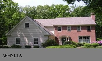 A Country Palace!  The ultimate custom built home!  Beautiful wooded setting with 3 acres, 4 BRs, two fireplaces, finished basement with 2nd kitchen, hand-crafted cherry molding and built-ins, cherry kitchen, steam sauna and dry sauna, and central vac. A Country Palace!  The ultimate custom built home!  Beautiful wooded setting with 3 acres, 4 BRs, two fireplaces, finished basement with 2nd kitchen, hand-crafted cherry molding and built-ins, cherry kitchen, steam sauna and dry sauna, and central vac.  Security System and much, much more!  More details and virtual tour at www.CAROLGARDINER.com