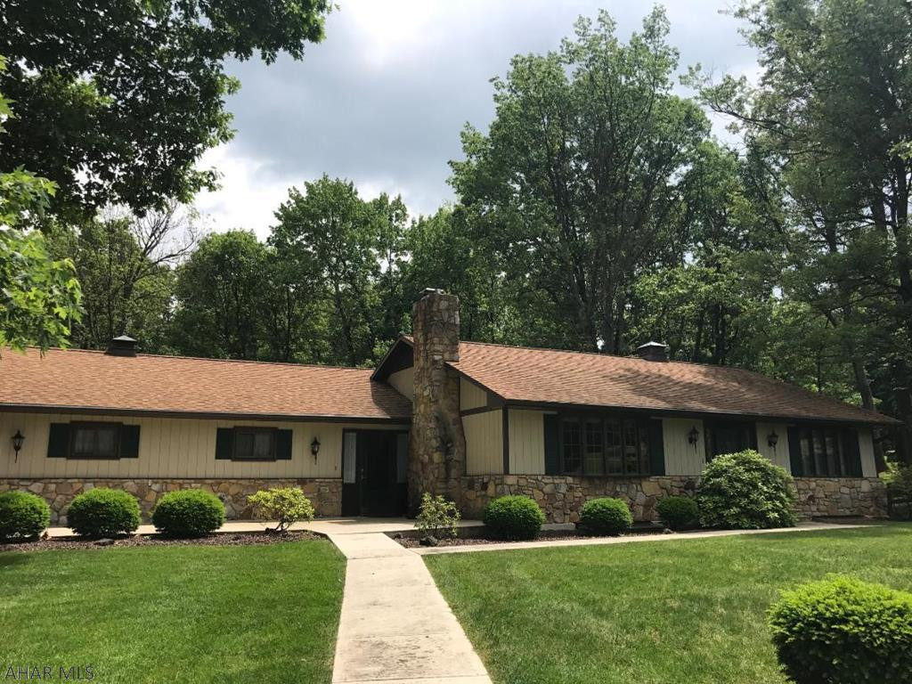 Very nice 1 story home that over looks the Iron Masters Golf Course. Large 1.97 acre lot, well maintained home. Fireplace in living room and wood stove in basement.