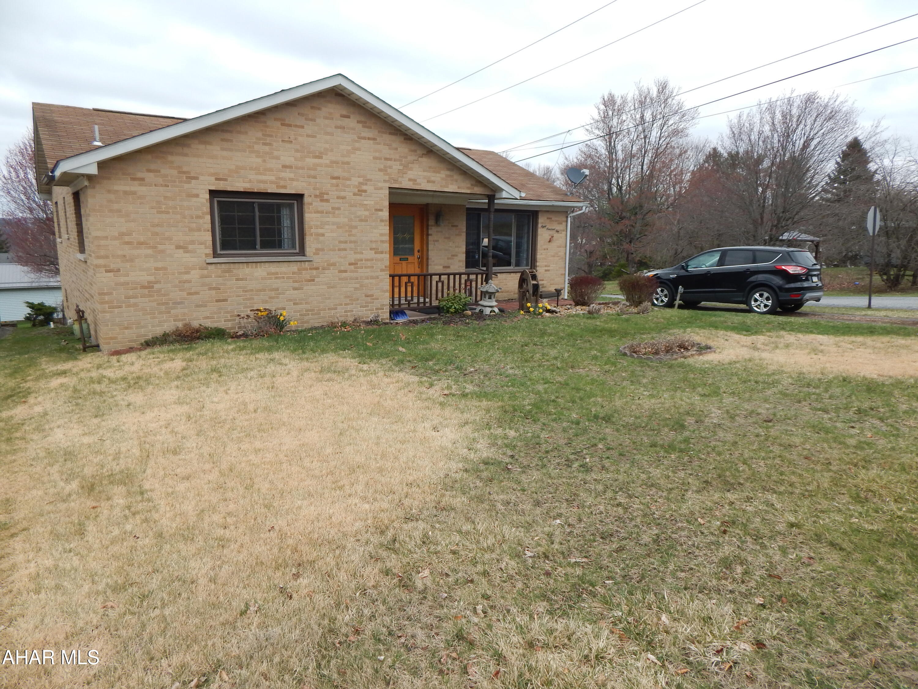 Video Tour Link: https://www.youtube.com/watch?v=hOPpm6Qg5_Q
This charming brick ranch nestled on a peaceful dead-end street, featuring a generously sized private bedroom, along with two additional average-sized bedrooms. This home provides plenty of space for relaxation and privacy. The main floor boasts a well-proportioned bath, kitchen, attached sunroom, and a bright living room filled with natural light, highlighted by a stunning brick wood-burning fireplace. Spacious full basement with a bar and 3/4 bath.

Step outside to the backyard, where you will discover a spacious deck and gazebo, ideal for entertaining. Also featured in the back is a generously sized two-car garage with storage above, providing ample storage for endless possibilities, along with an attached shed for added convenience. There is so much more to explore—call for your tour today!