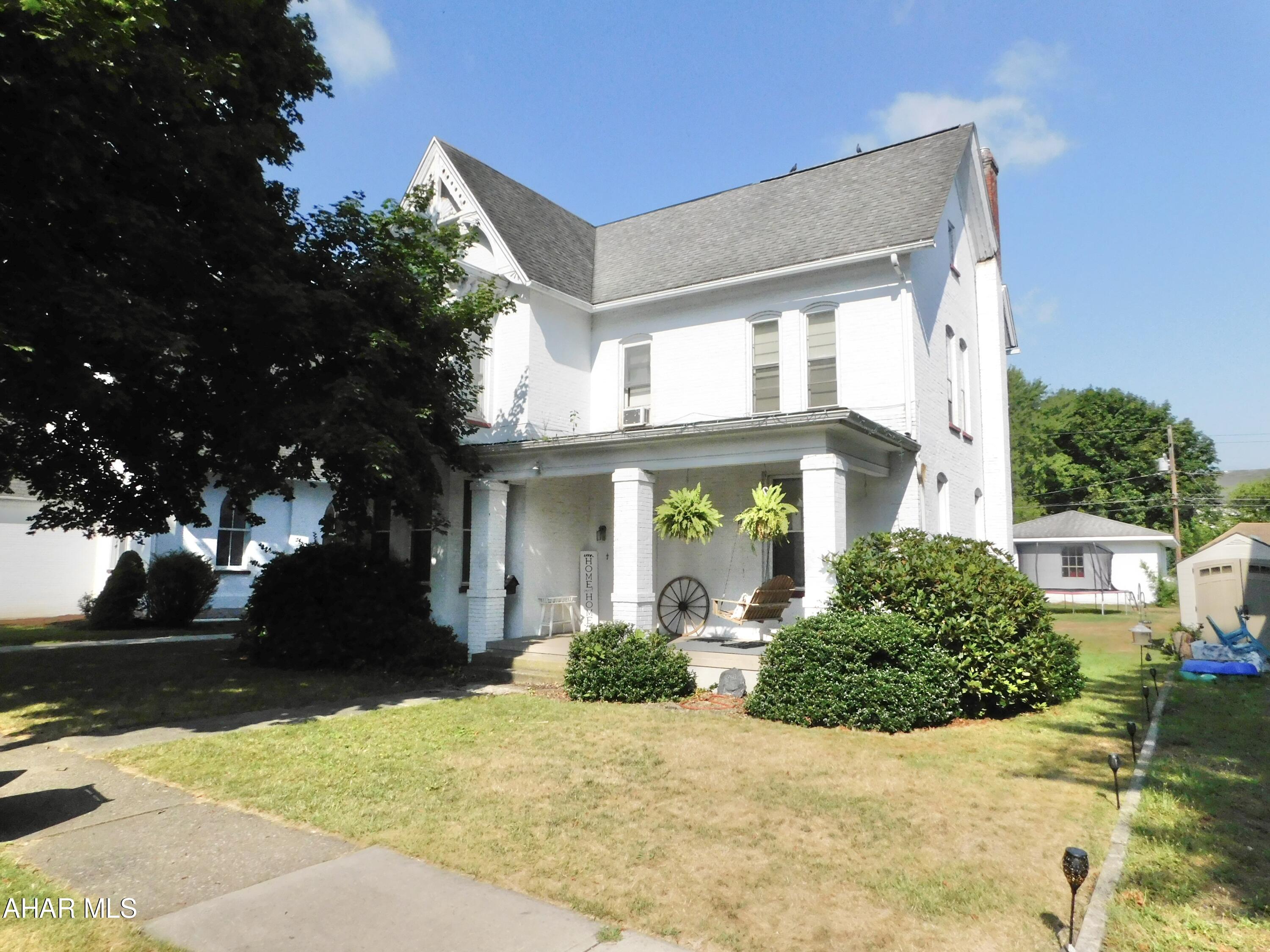 This is a solid brick well loved home that oozes so much character and space! Pocket doors, hardwood floors, large rooms, 2 kitchen pantries & corian countertops. An attic for storage and a bonus room on 2nd floor that would be great for an extra walk-in closet. High basement with 1/4 bath. Great bones & most windows have been replaced. All situated right in the Boro close to school and on a flat lot.