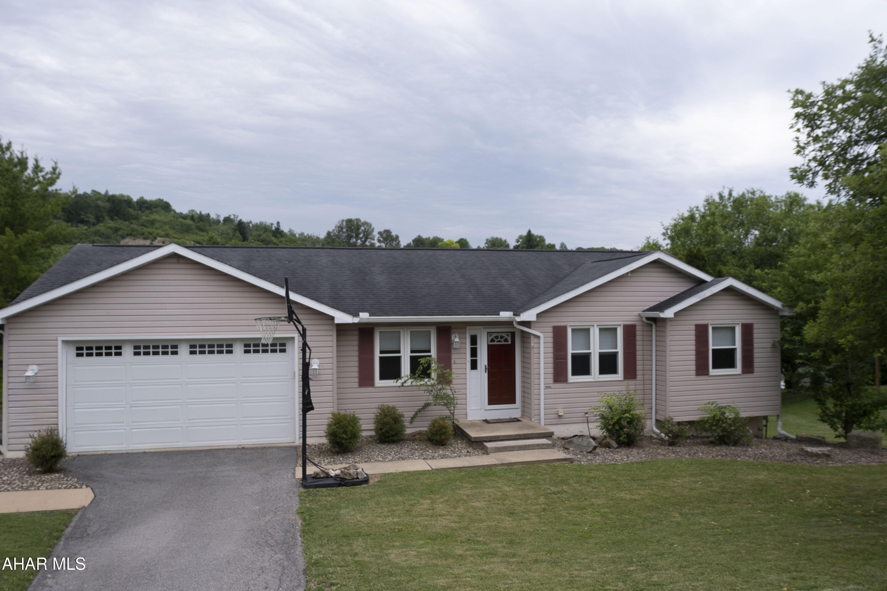 Welcome to 623 Orchard Drive in the desirable Penn Farms neighborhood! This well-maintained ranch-style home offers 4 bedrooms, 3.5 baths, and over 2,700 square feet of finished living space. The spacious primary suite features a walk-in closet and private full bath, while the main level also includes an additional full bath and convenient half bath with laundry. The kitchen opens to a raised deck through French doors, creating an ideal space for relaxing or entertaining with elevated views of the fenced backyard. The finished walkout lower level adds exceptional flexibility with a large recreation area, gas fireplace, fourth bedroom, and full bath. Additional highlights include an attached 2-car garage, central air, natural gas heat, solar panels to help reduce electric costs, and a storage shed beneath the deck. Conveniently located near shopping, dining, and everyday amenities.
