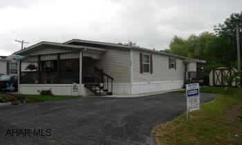 1997 CHAMPION DOUBLE!  IMMACULATE 2 BEDROOM, 2 BATH ON RENTED LOT.  LOT RENT IS $225/MONTH.  CORNER LOT, CENTRAL AIR, COVERED PORCH, EAT-IN KITCHEN, 2 SHEDS, OFF STREET PARKING!